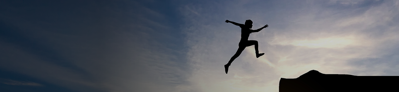 Man jump through the gap between hill - banner